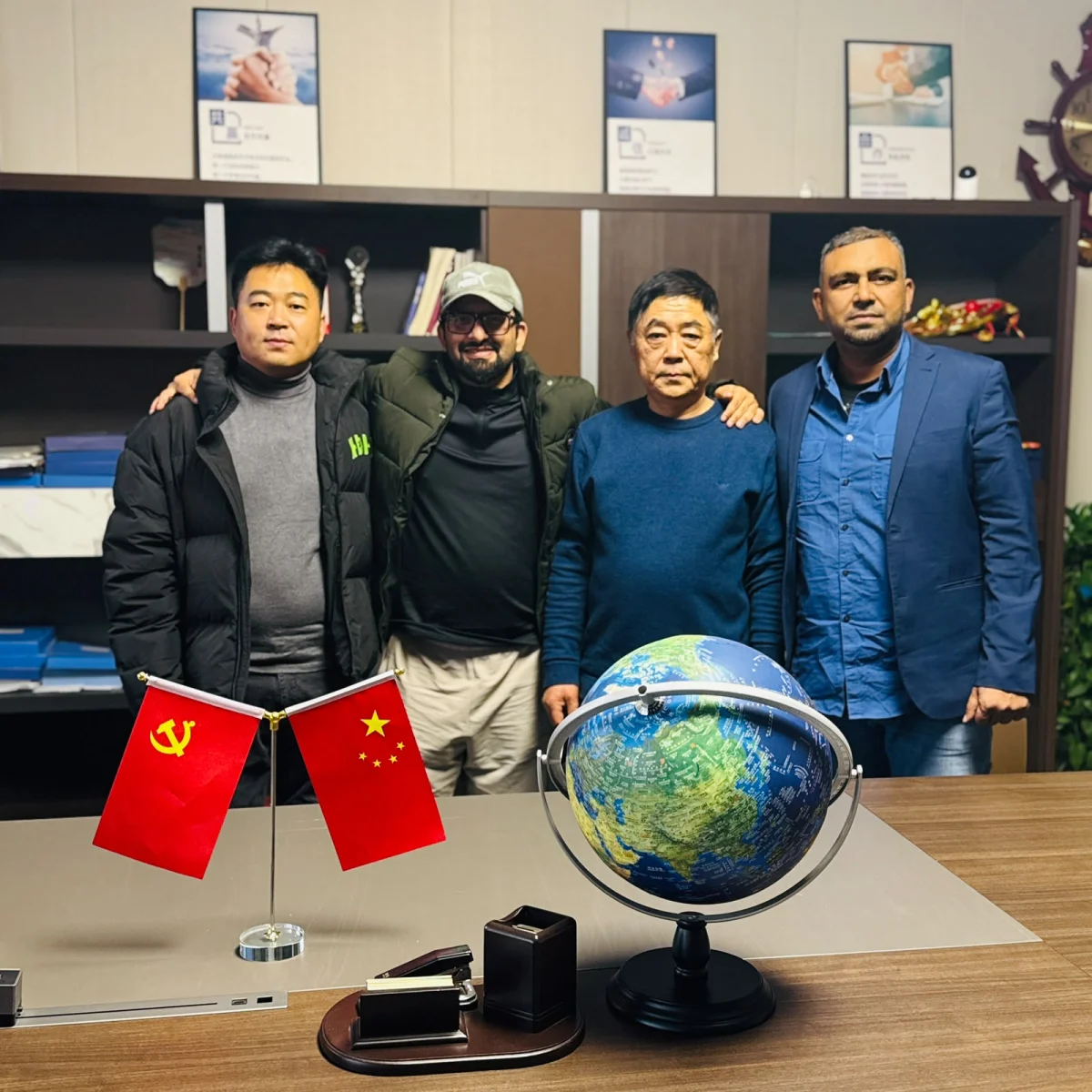 4U Business Links team with partners at a manufacturer office in China